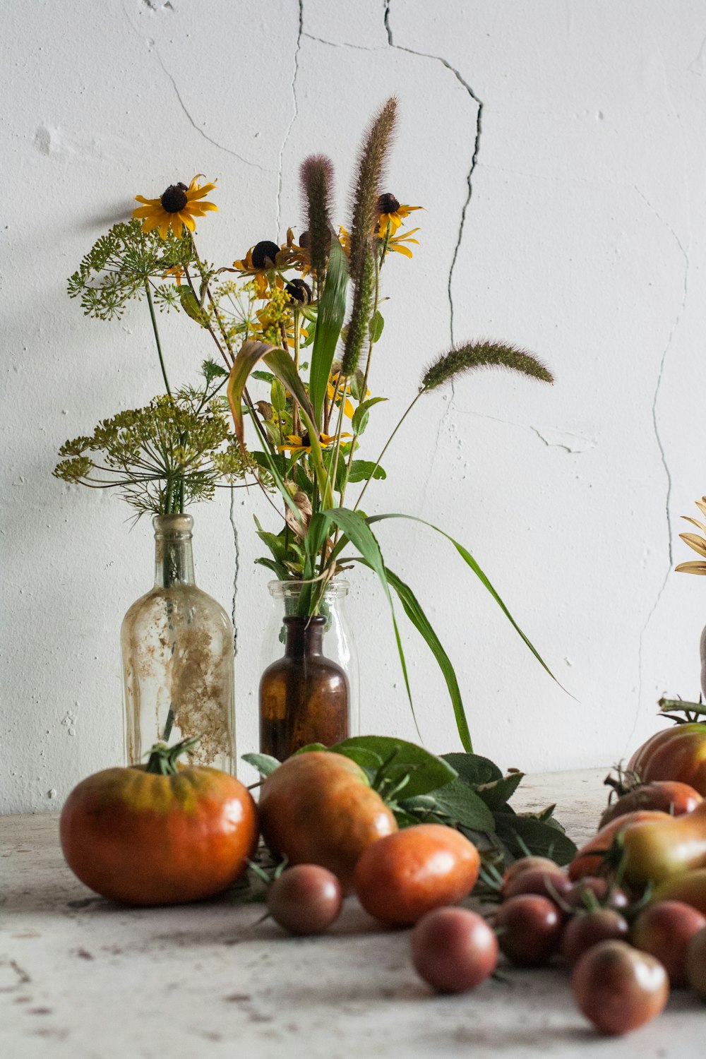 yellow flowers in clear glass vase