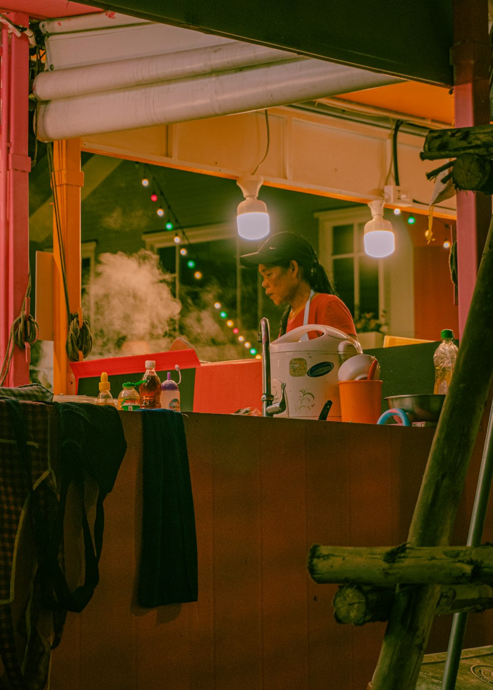 woman in white and red dress standing near table