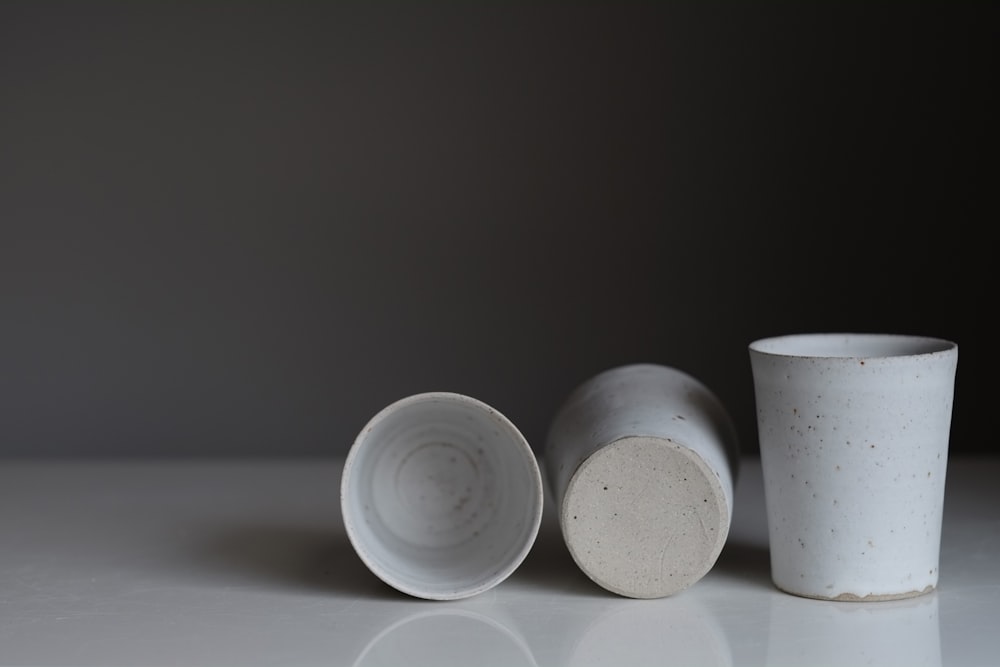 white round plastic containers on white table