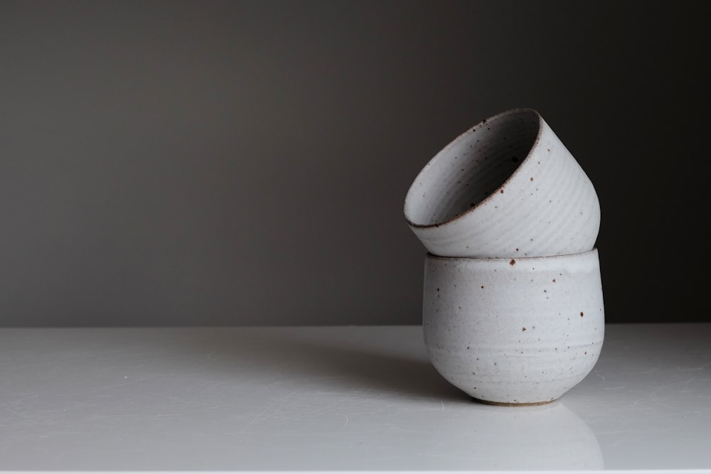 white ceramic vase on white table