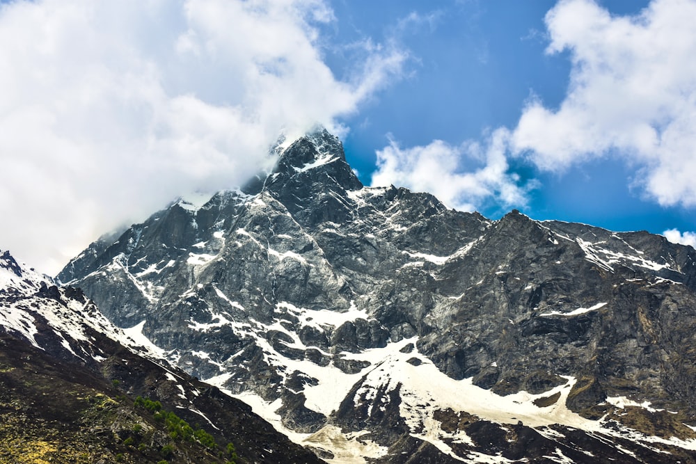 snow covered mountain under blue sky during daytime