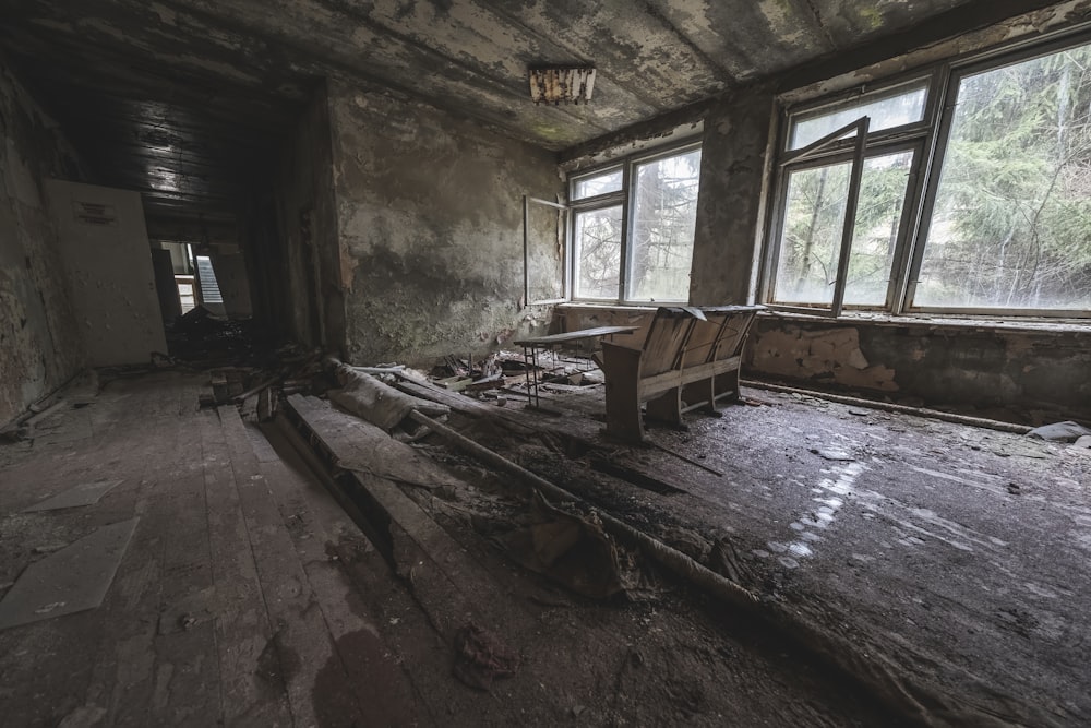 brown wooden bench near window