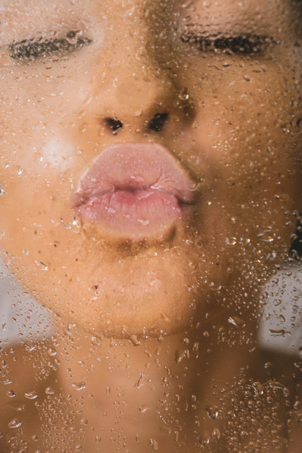 woman in water with water droplets
