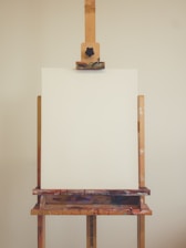An artistic shot of a blank canvas with faint pencil outlines, symbolizing ideas waiting to come alive.