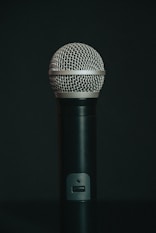 black microphone on black surface