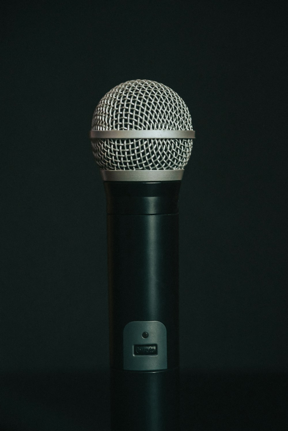 black microphone on black surface