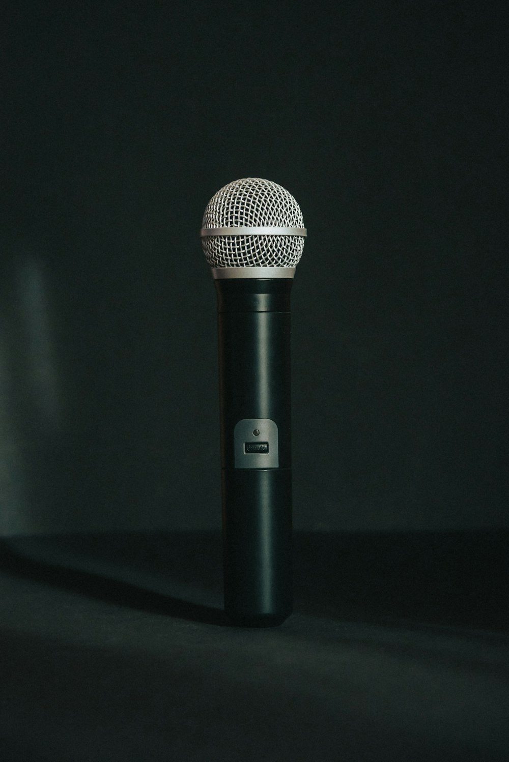 black microphone on black table