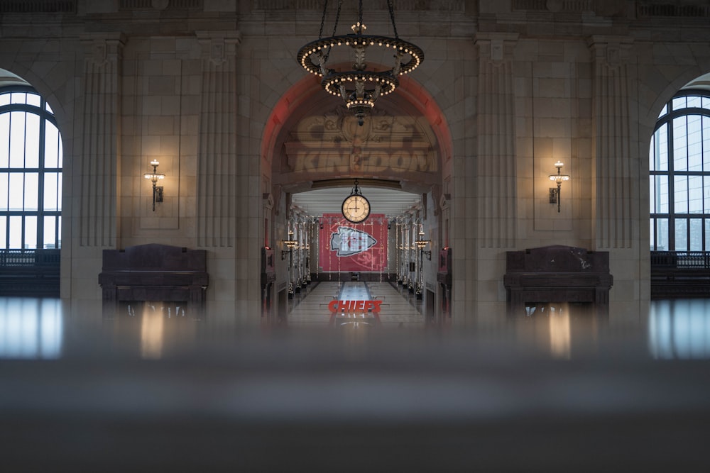 red and gold chandelier turned on in a room