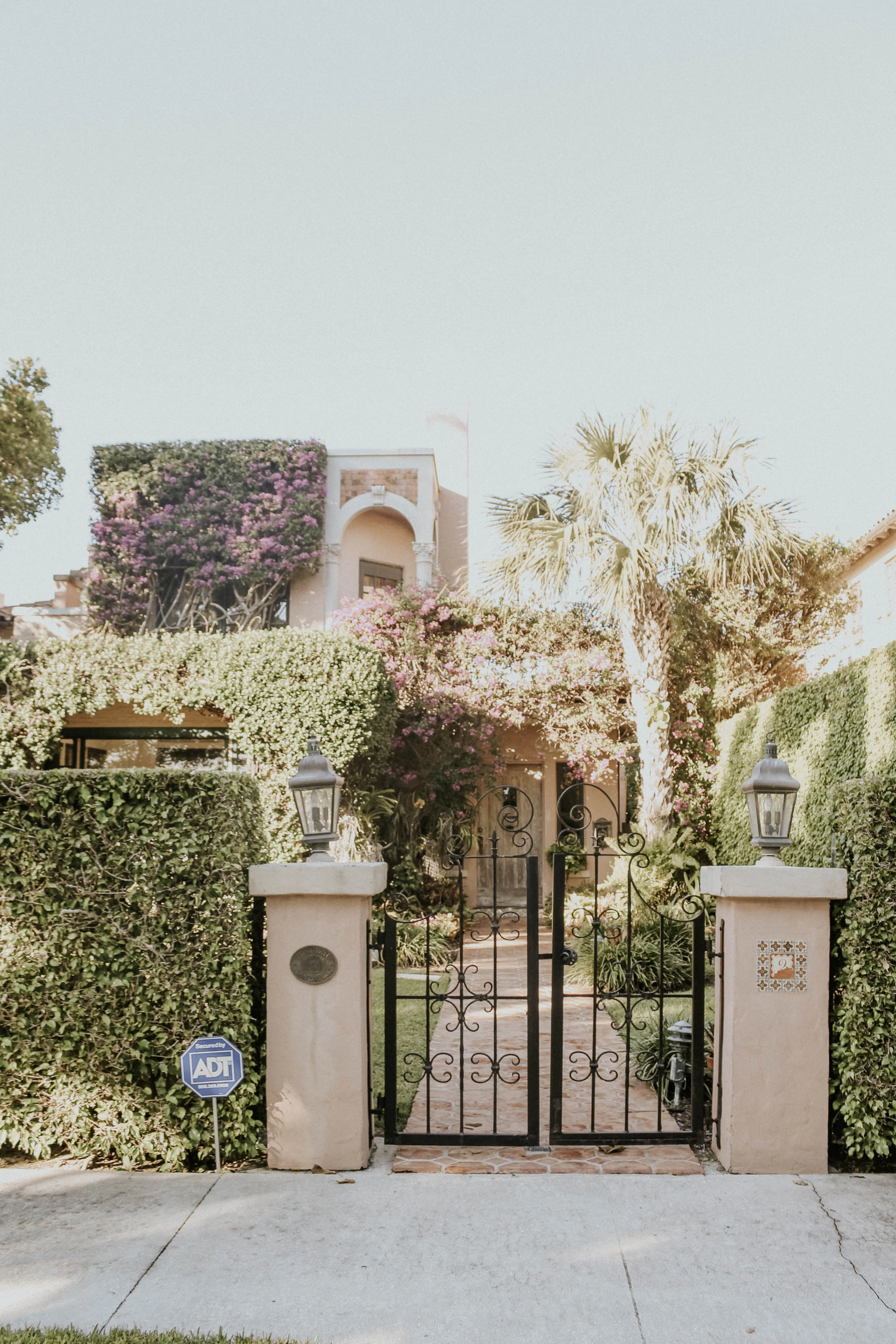 A welcoming facade of a ready-for-occupancy house in the Greater Manila Area, with a small garden and secure gate.