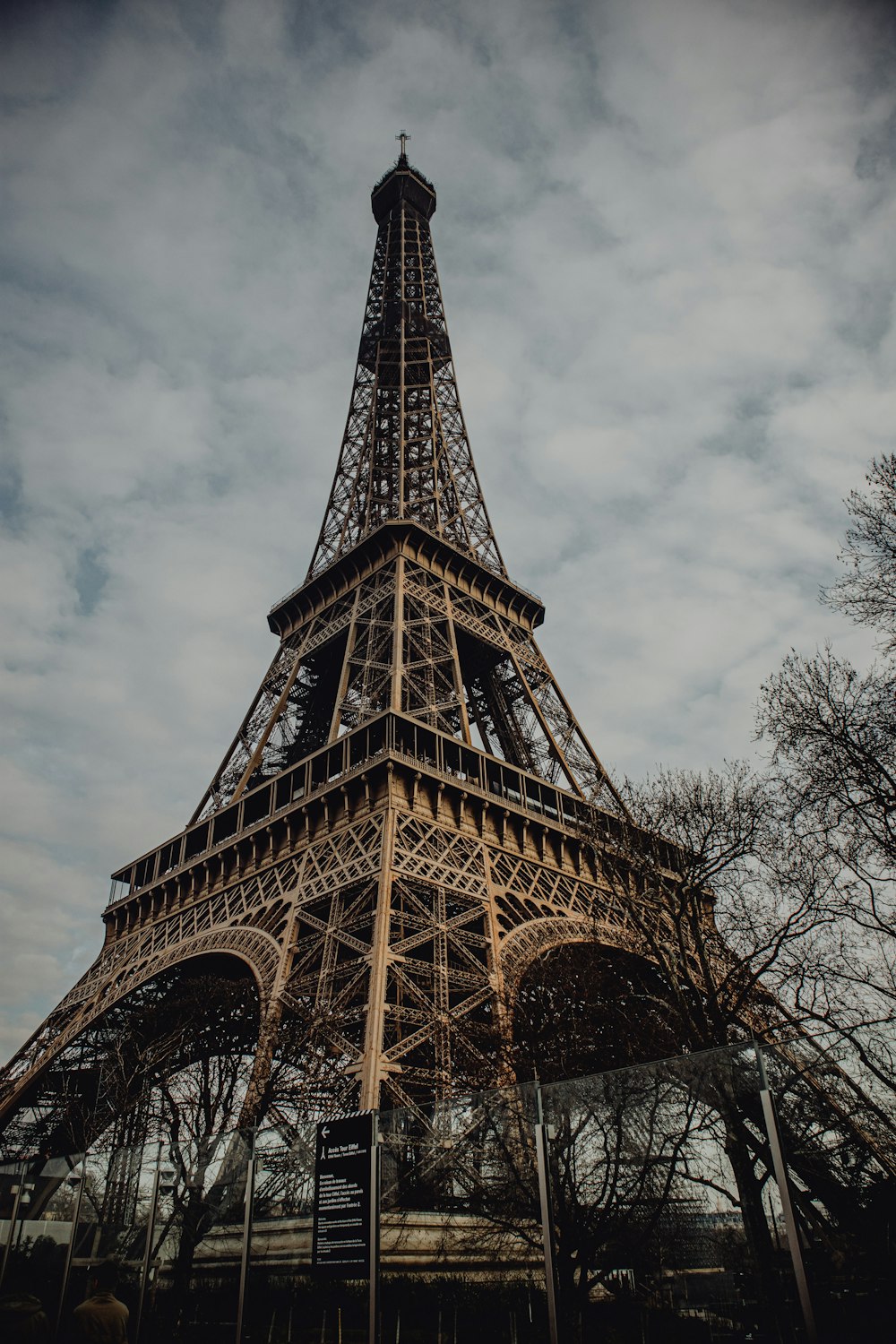 eiffel tower under gray cloudy sky