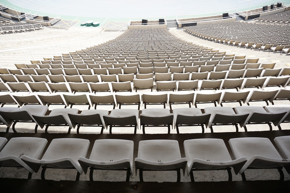 white and gray chairs on stadium
