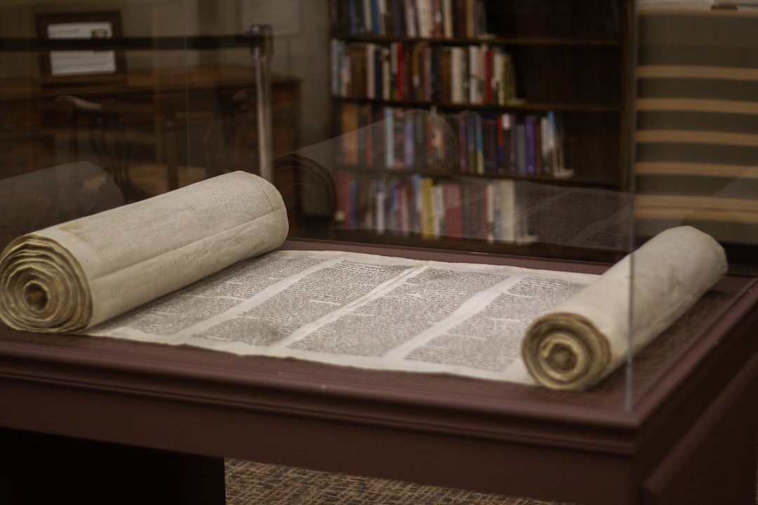 white and brown wooden table, The unveiling of the new Torah display at Trinity International University