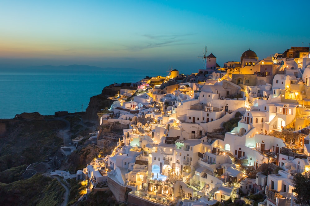 white and brown concrete houses on mountain near sea during daytime