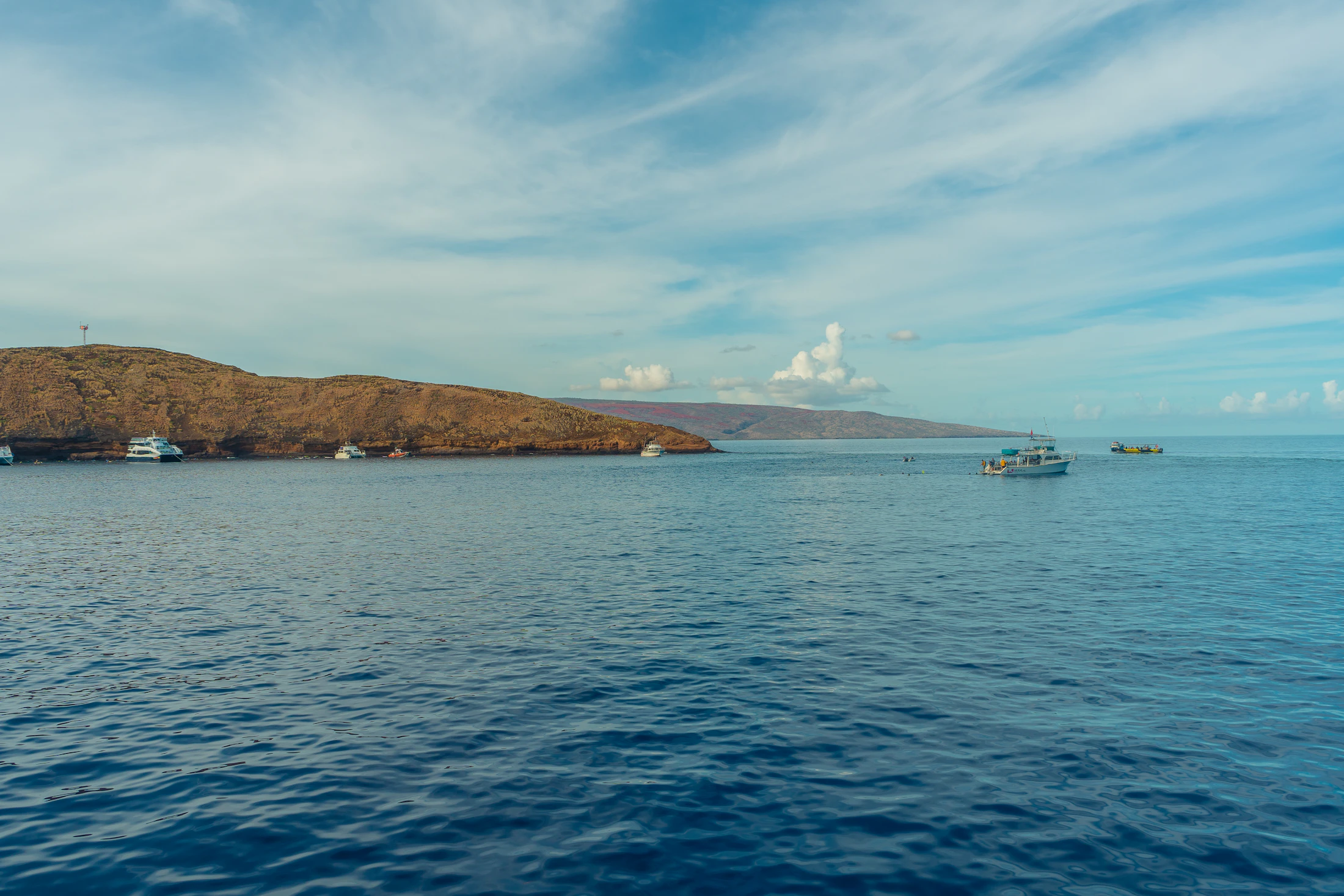 Molokini Crater off Maui with boats on the water