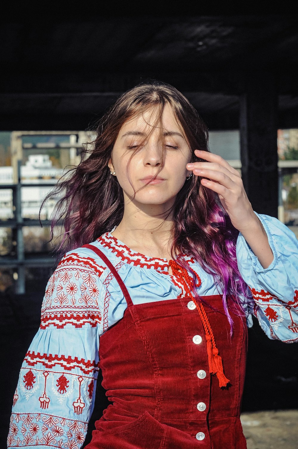 woman in red and white floral shirt