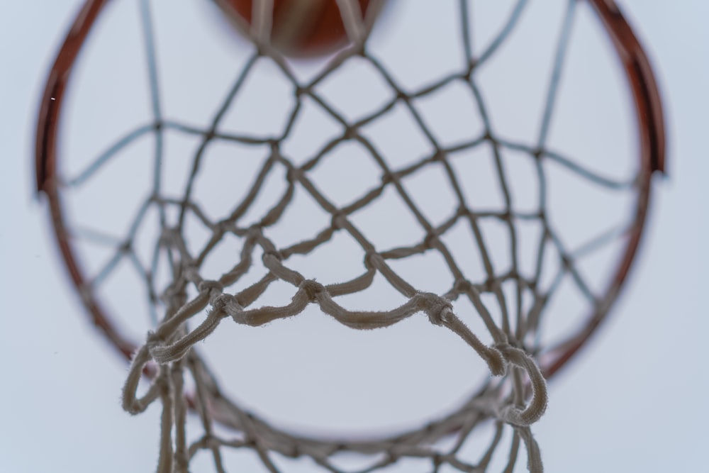 red and black basketball on net