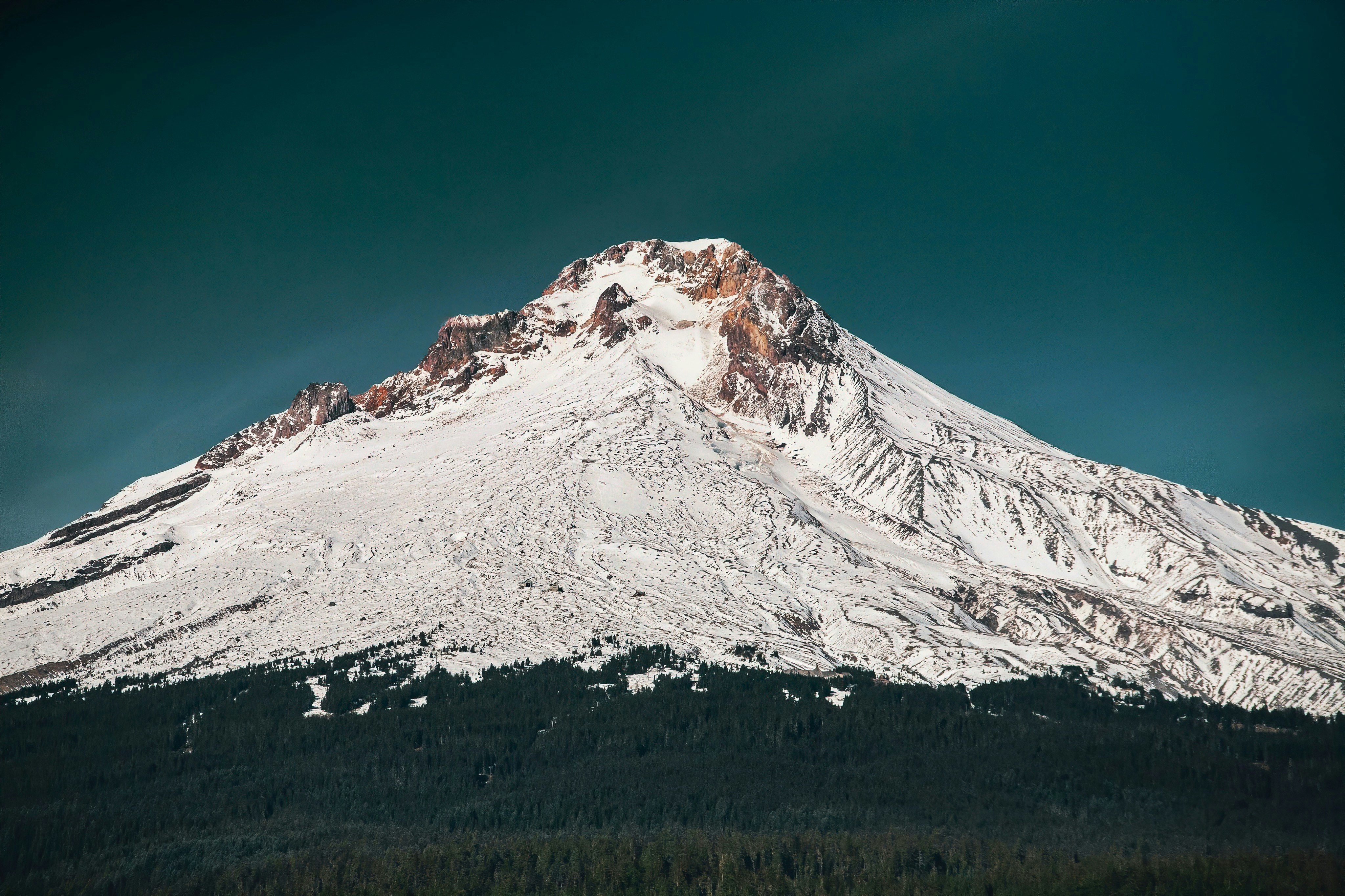 snow covered mountain under blue sky during daytime