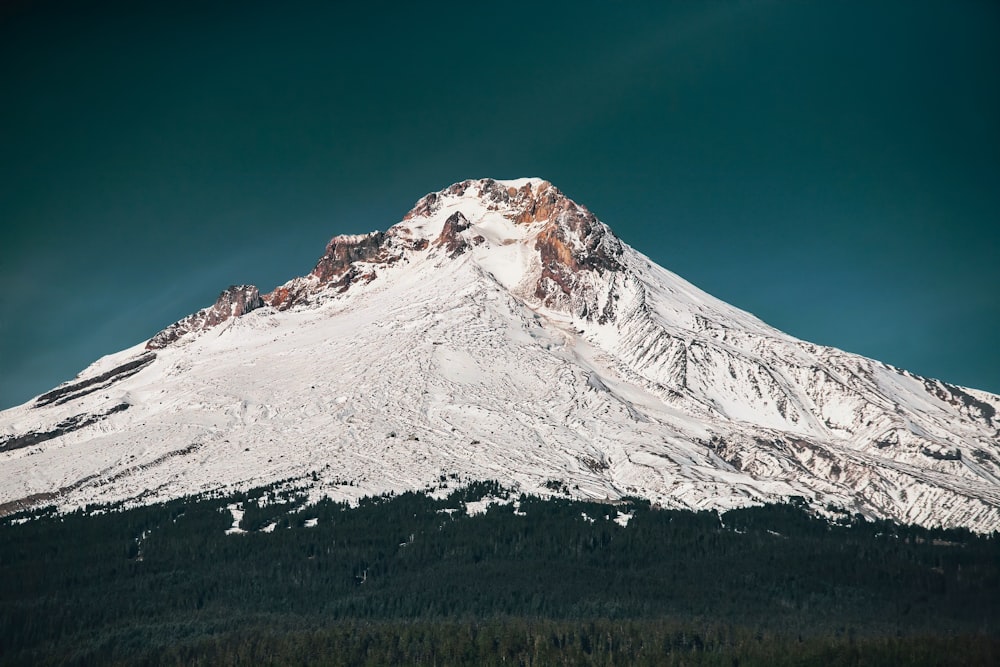 snow covered mountain under blue sky during daytime