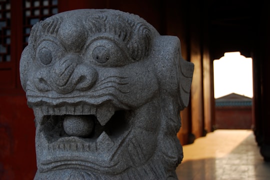 black concrete statue of man in Hunan China