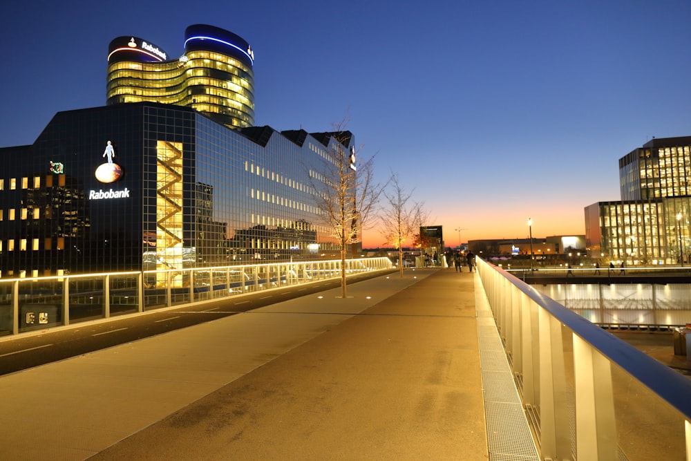 city buildings with lights turned on during night time