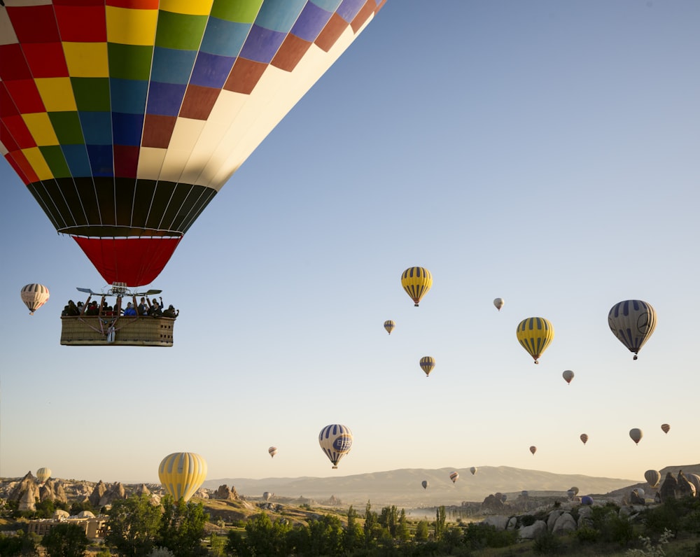 hot air balloons flying during daytime