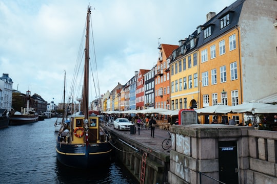 boat on dock near buildings during daytime in Mindeankeret Denmark