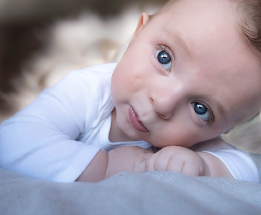 baby in blue long sleeve shirt