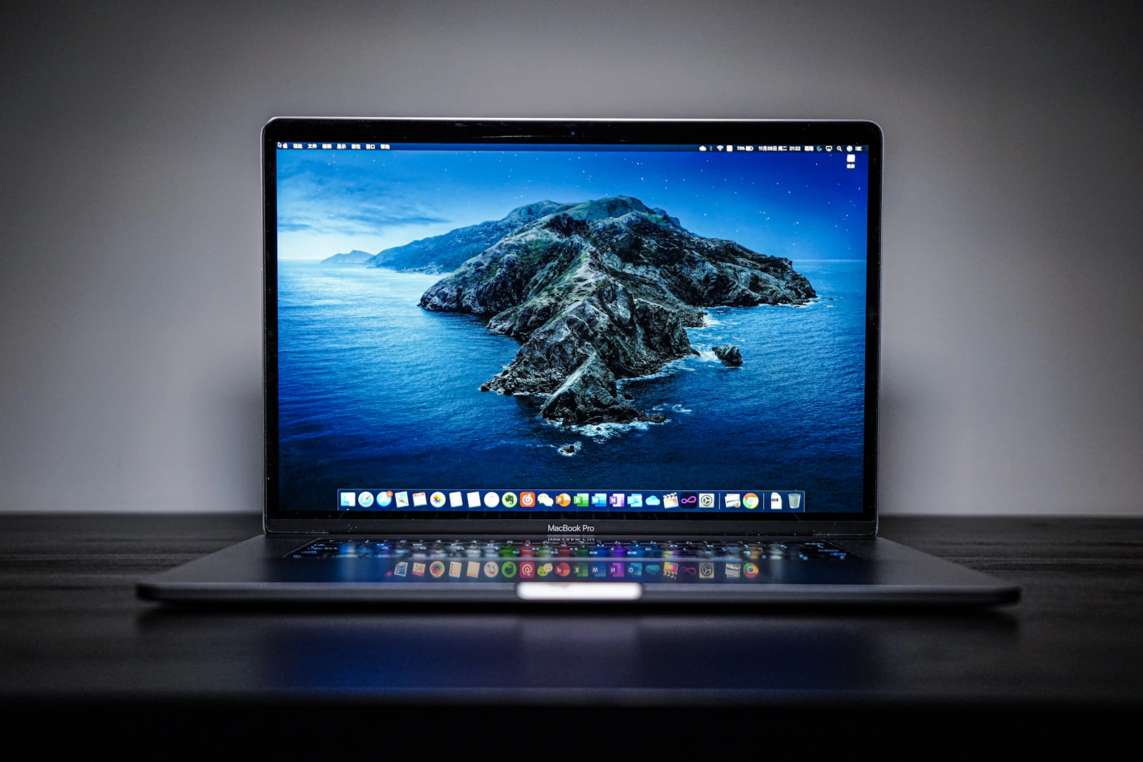 A laptop on a desk showing text on screen
