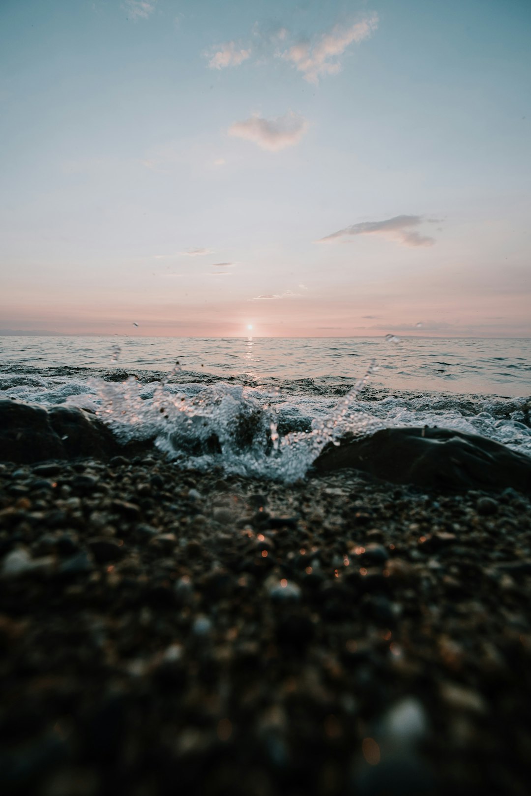 black stones on seashore during sunset