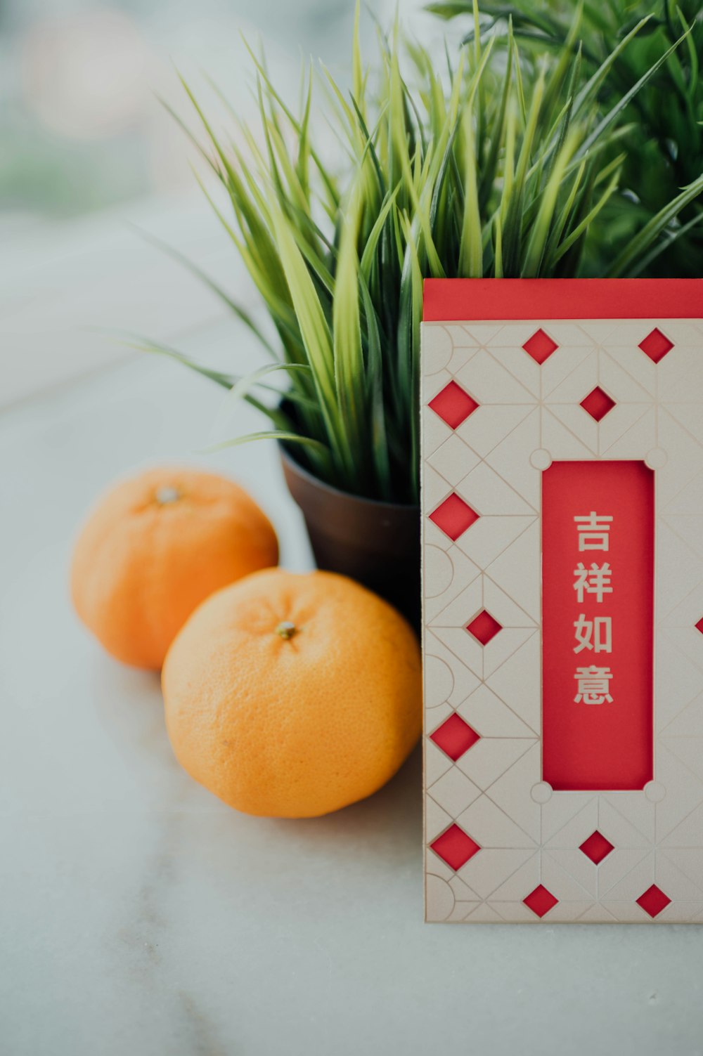 orange fruit beside red and white box