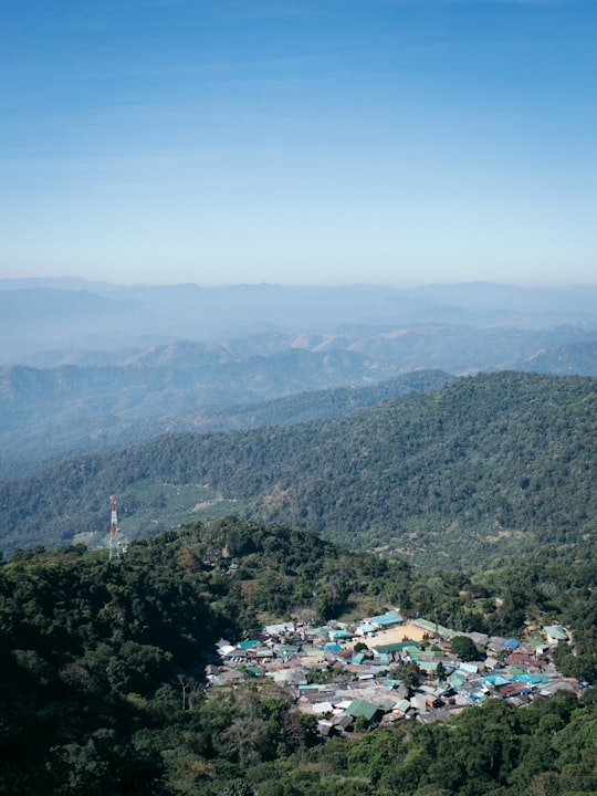 green mountains under blue sky during daytime in Doi Suthep Chiang Mai Thailand