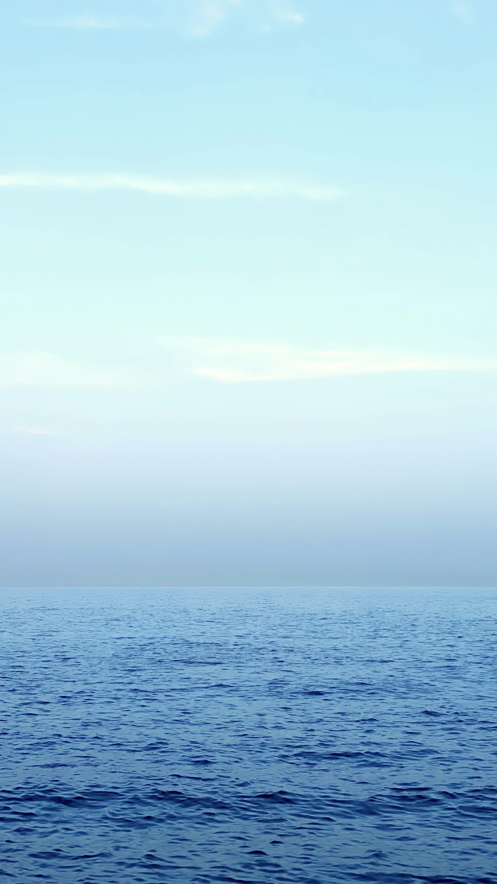 blue sea under white sky during daytime