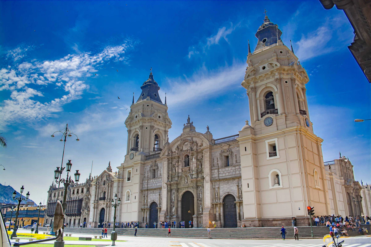 An ornate historic church façade beneath blue sky in central Lima