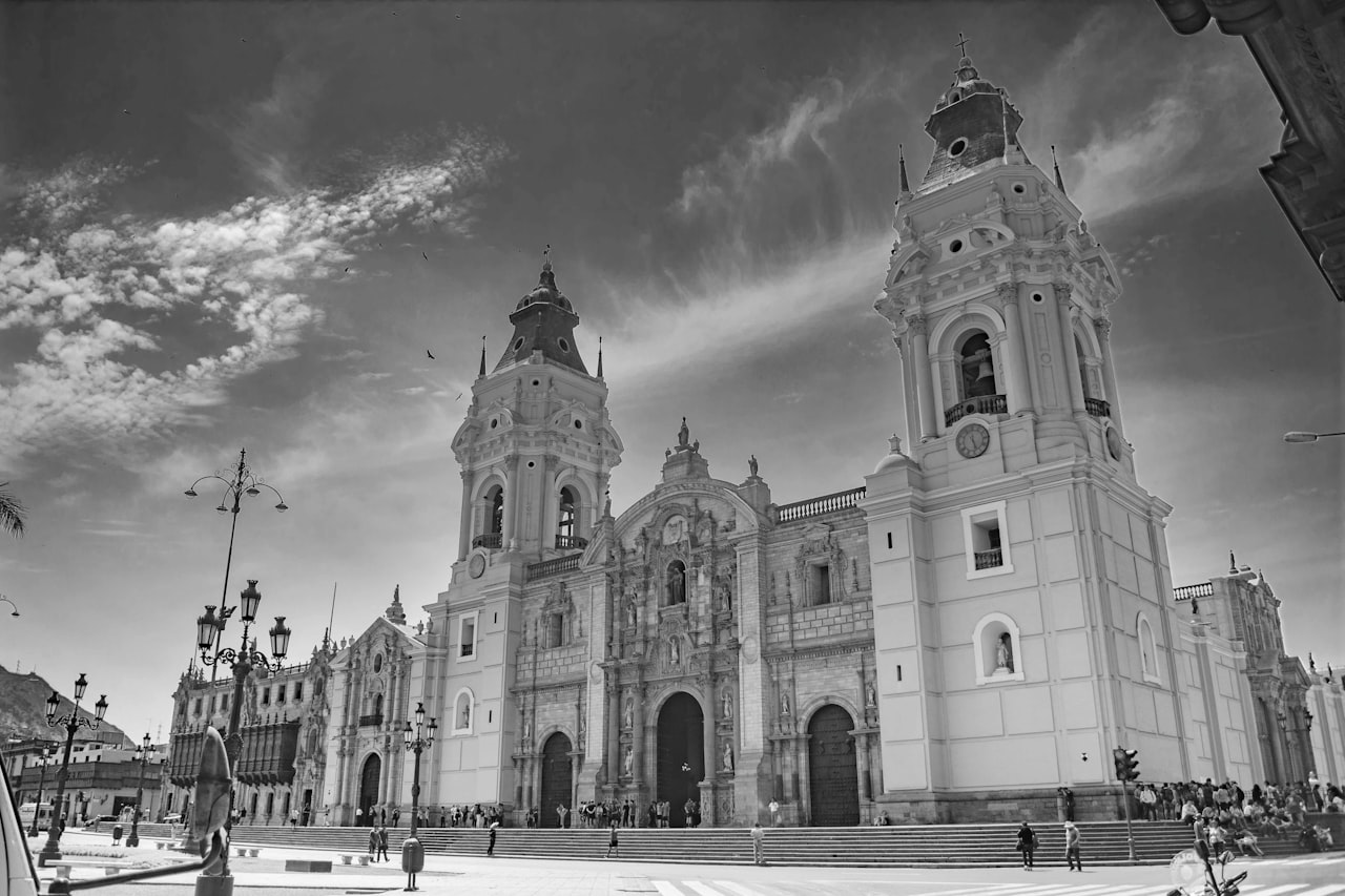 Lima beige concrete church under blue sky and white clouds during daytime where you can leave your luggage
