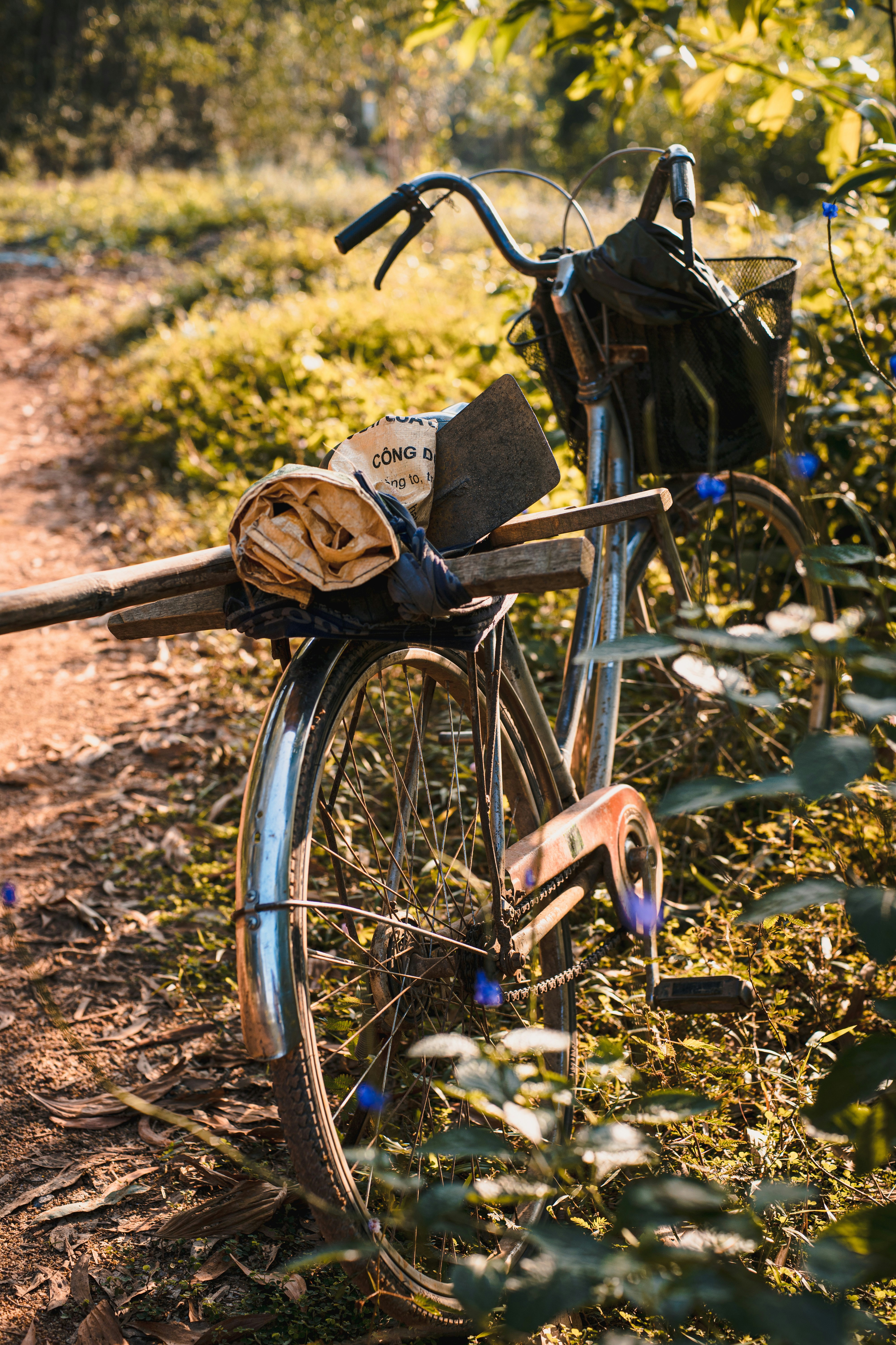 brown wooden bicycle with brown wooden basket on top