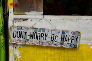 white and blue wooden signage
