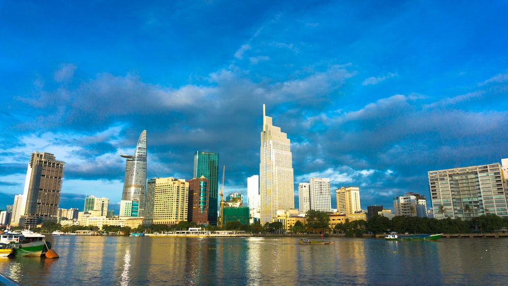 city skyline across body of water during daytime