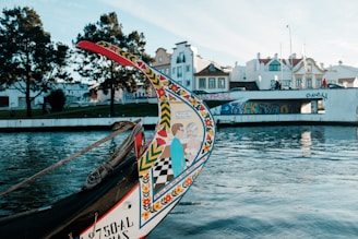 white and red boat on water during daytime