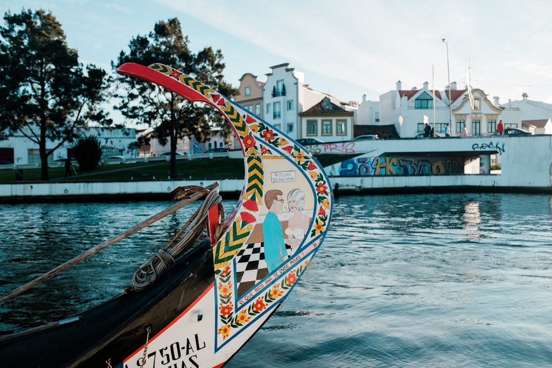 white and red boat on water during daytime