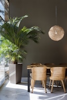 Elegant marble dining table set in a bright room with natural light pouring in.