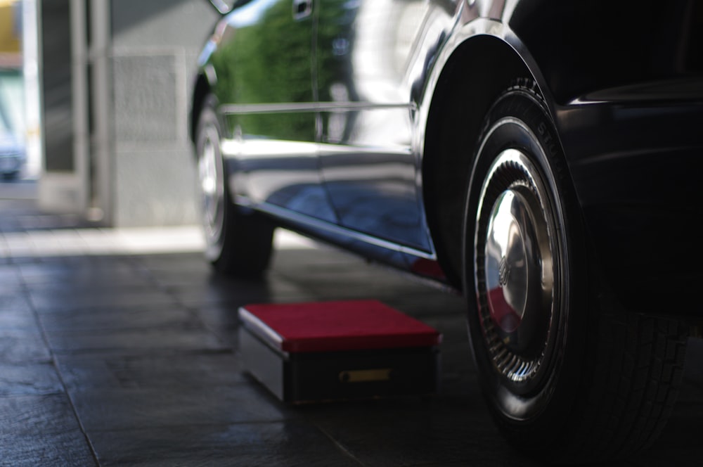 black and red car on road