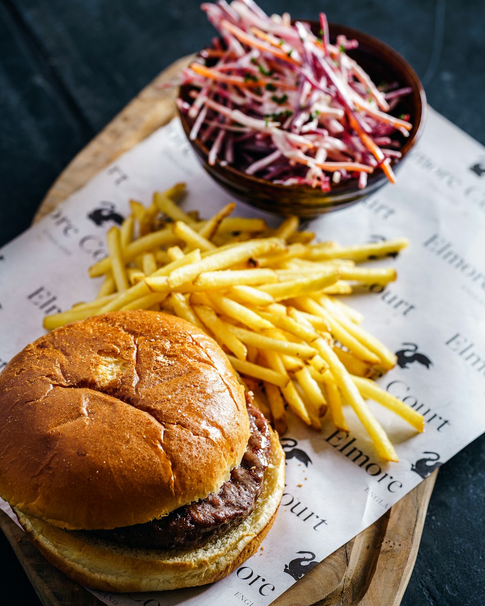 burger and fries on white paper