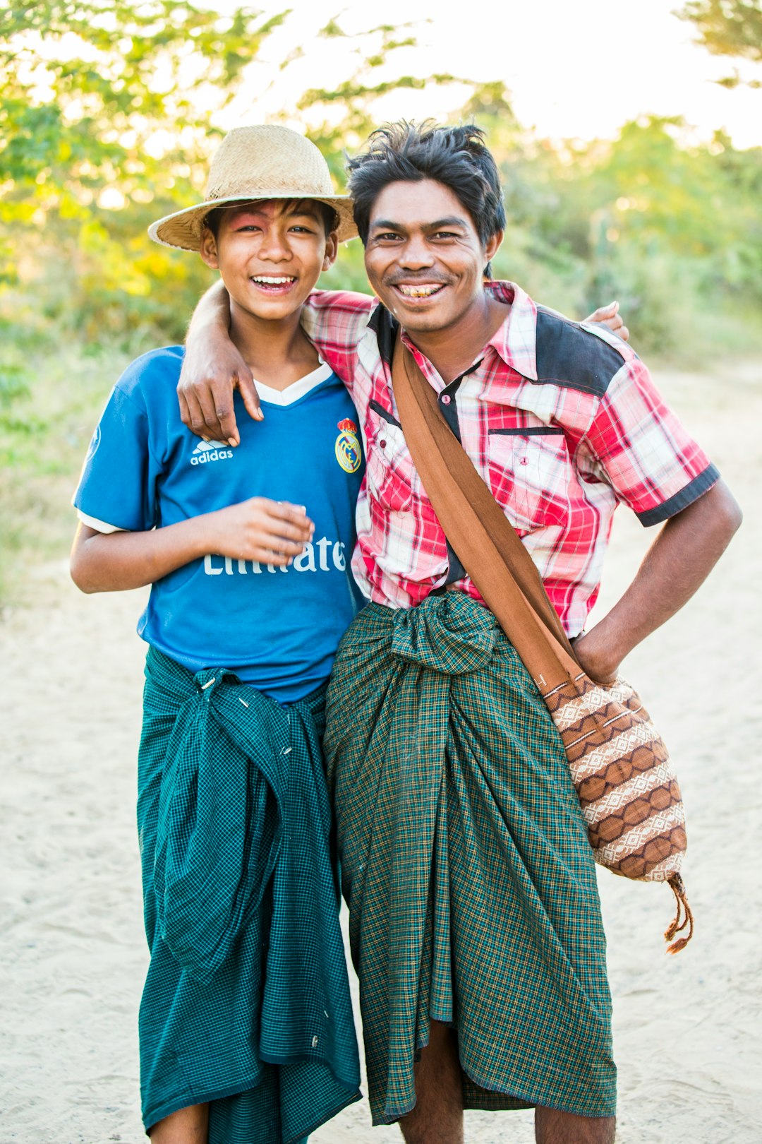 man in blue crew neck t-shirt beside woman in blue and white dress