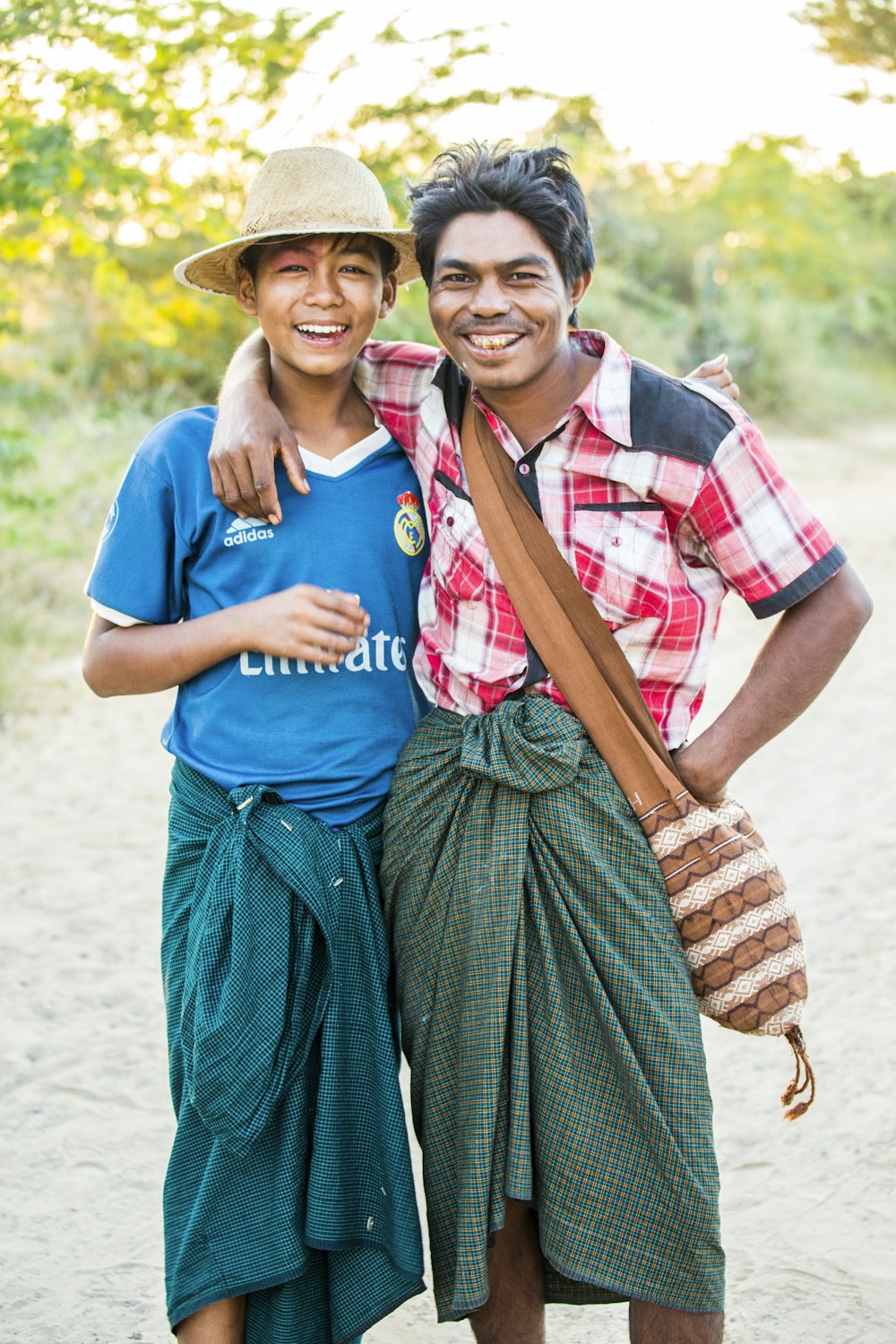 man in blue crew neck t-shirt beside woman in blue and white dress