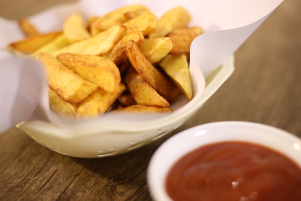 Potato chips on white ceramic bowl