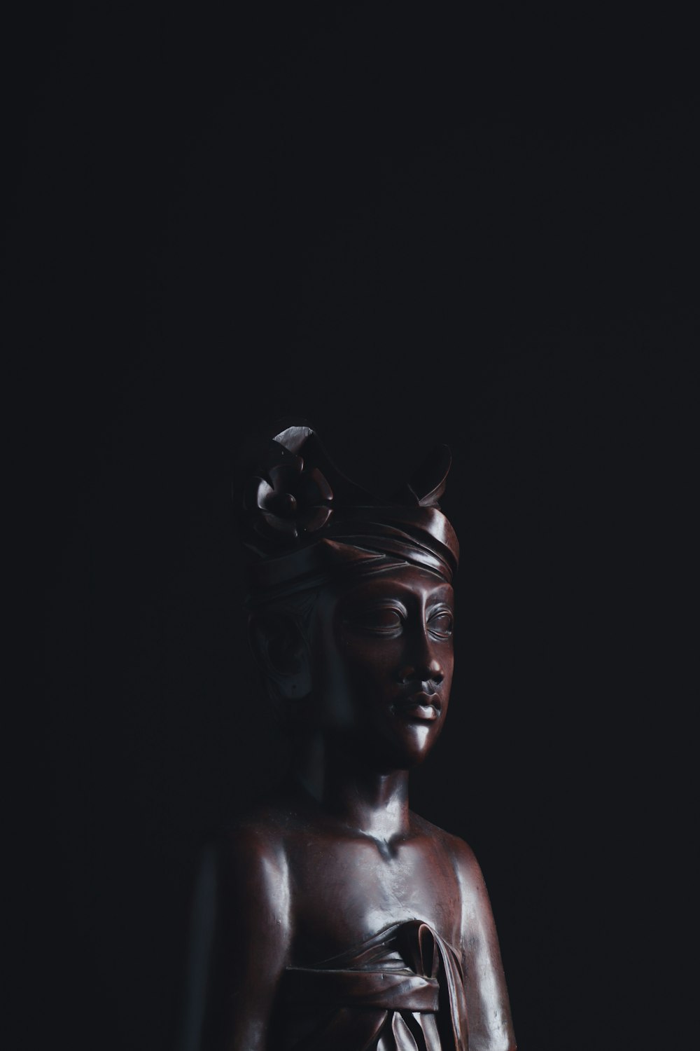 black concrete statue of a woman