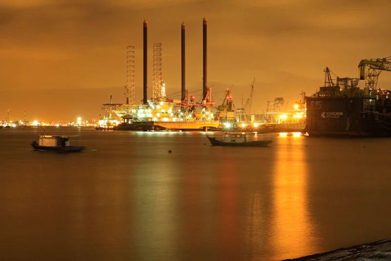 Offshore oil rig at night representing the Strait of Hormuz reopening and its impact on India