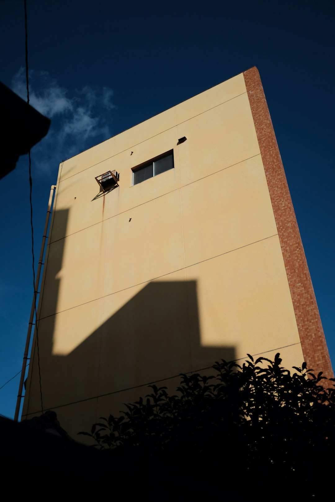 white concrete building under blue sky during daytime