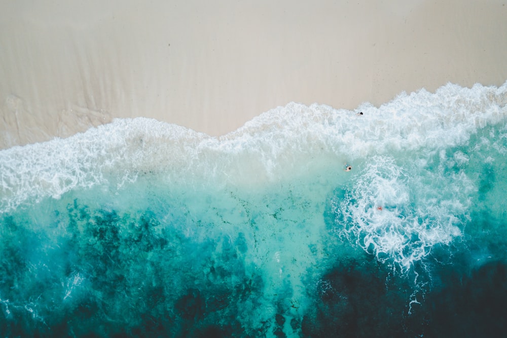 white and blue ocean waves