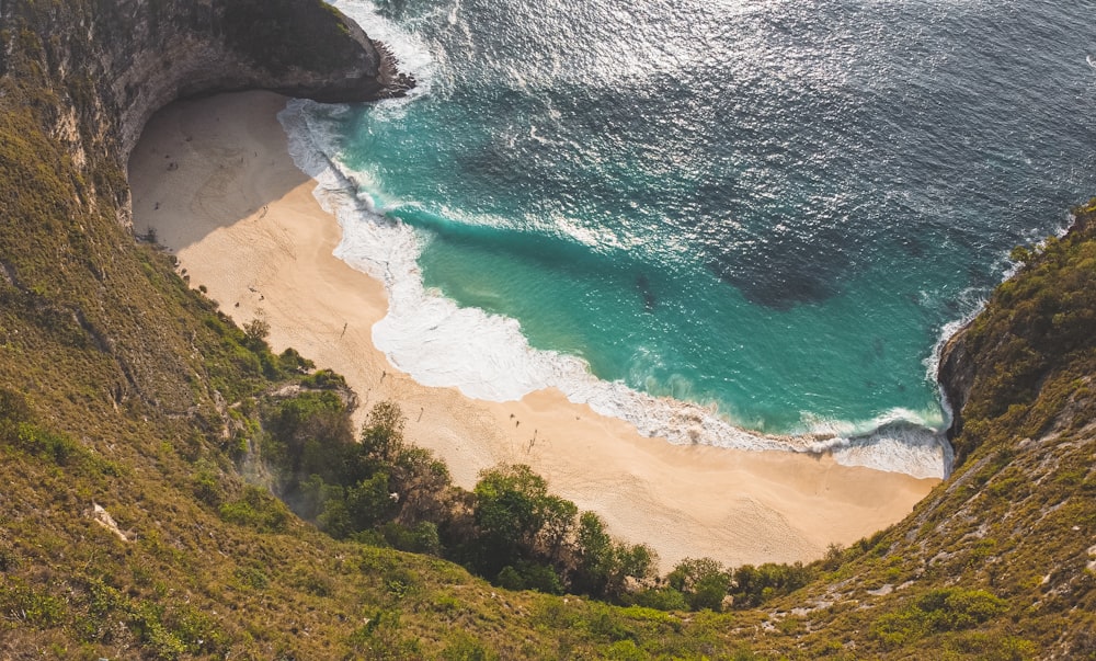 an aerial view of a beach and a cliff